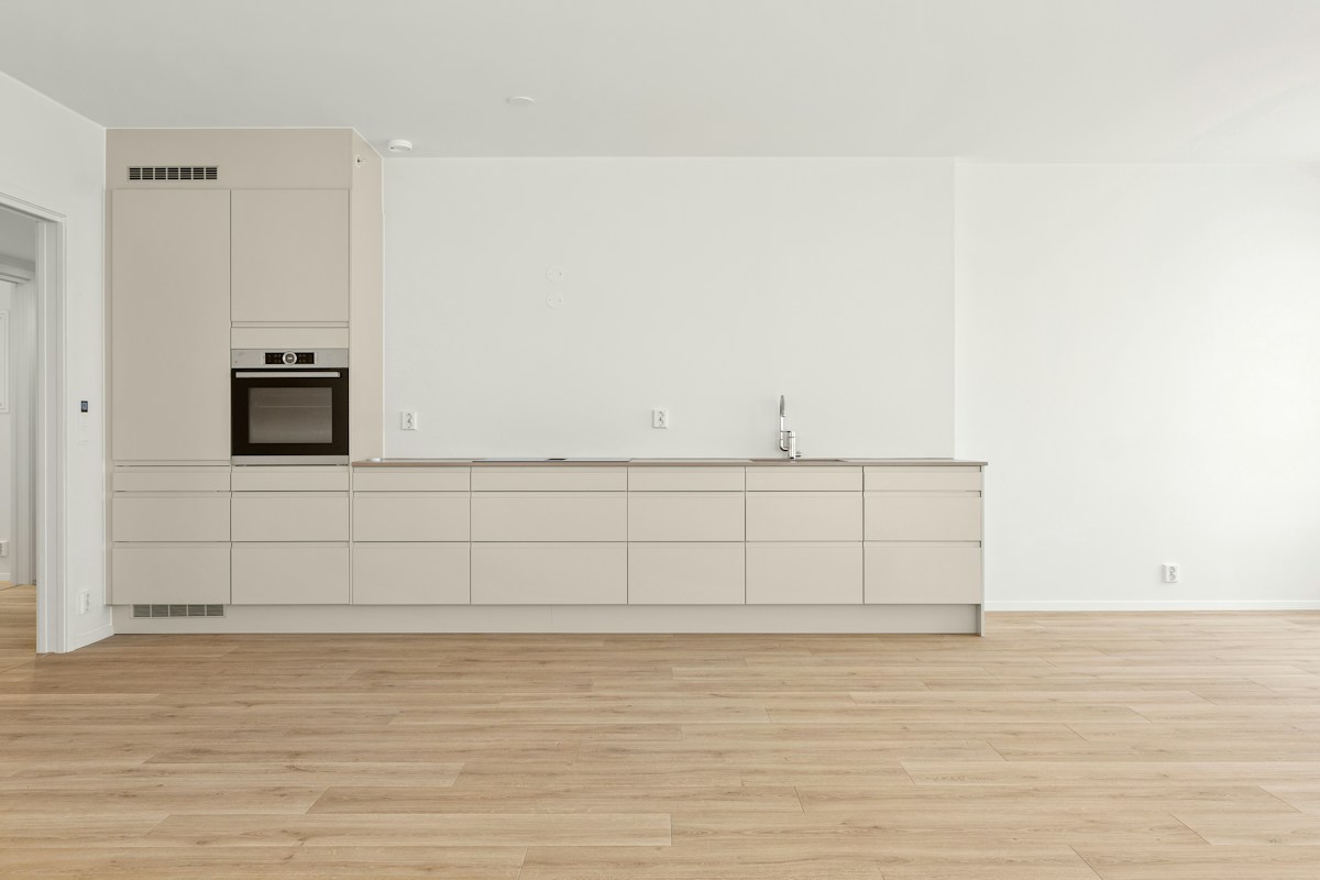A bright kitchen with natural wood flooring