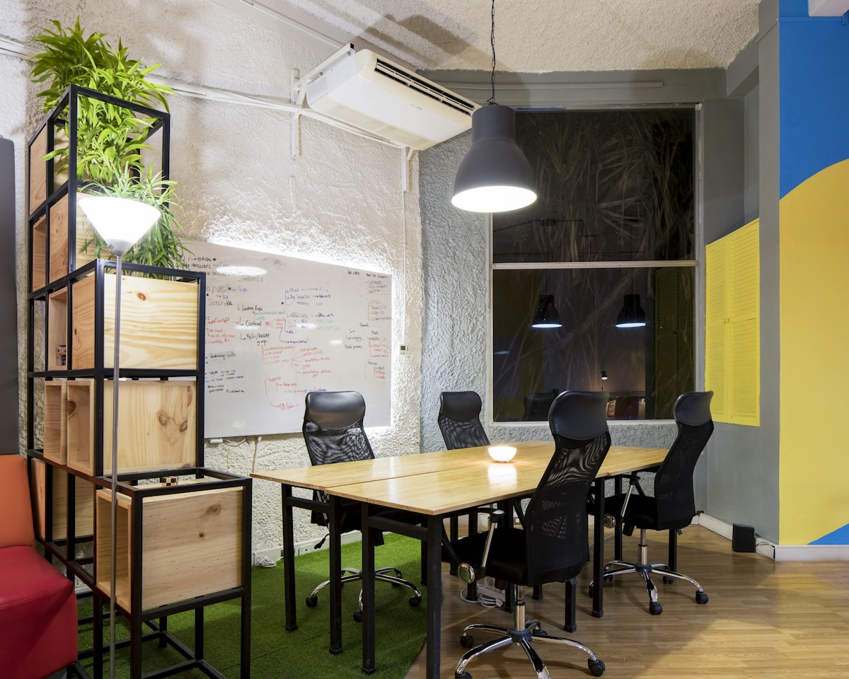 A bright workspace with a table and chairs