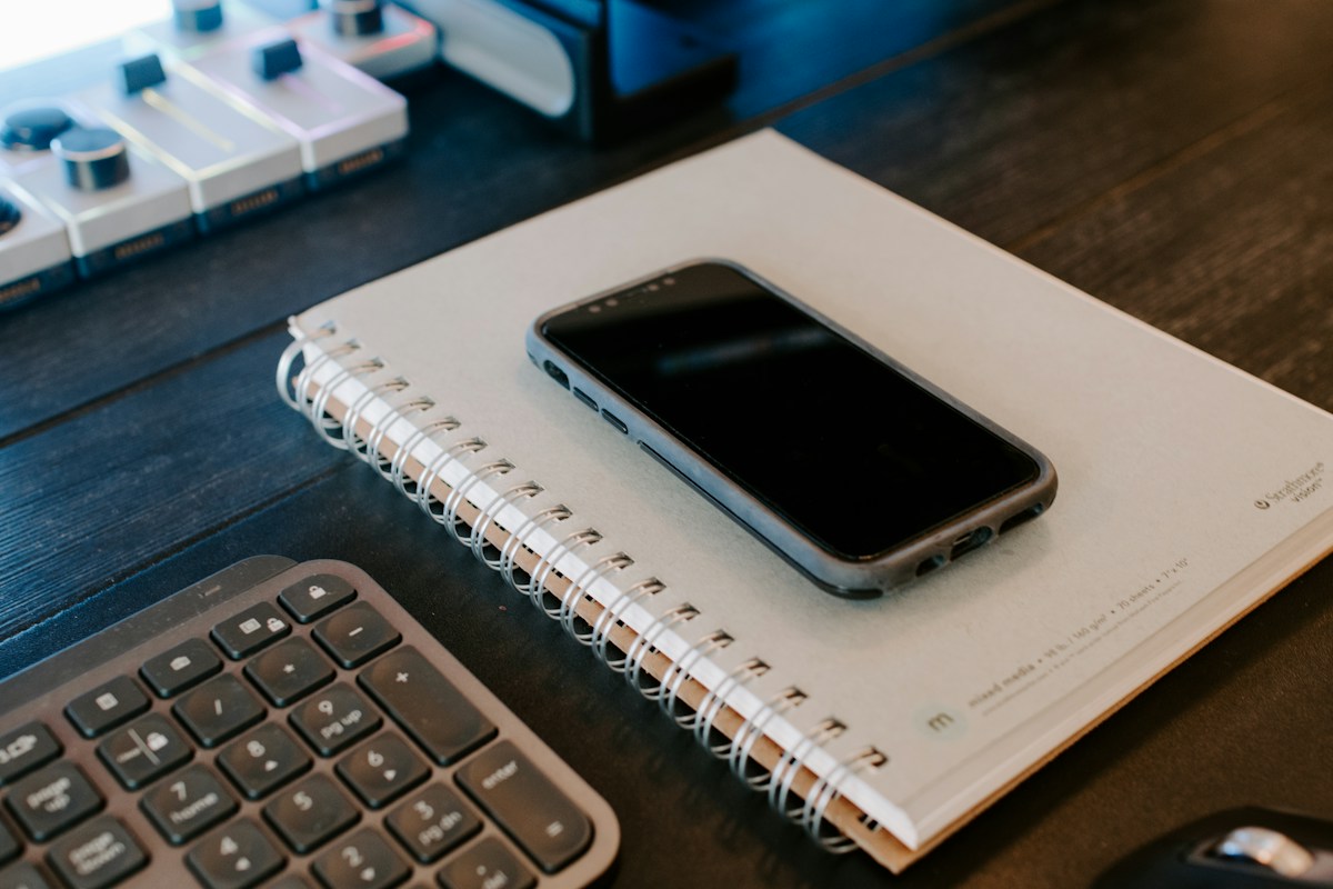 Phone and notebook ready for resident communication